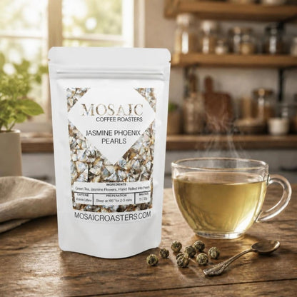 Jasmine Phoenix Pearls green tea pouch with a glass cup of jasmine tea