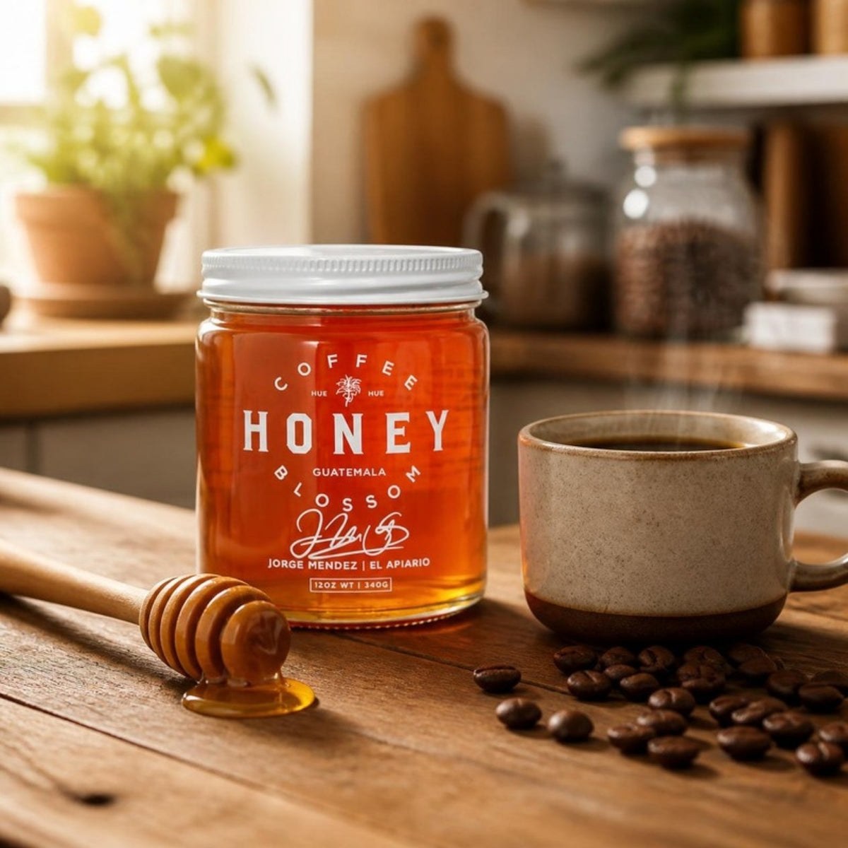 Coffee Blossom Honey jar with honey dipper and a cup of coffee